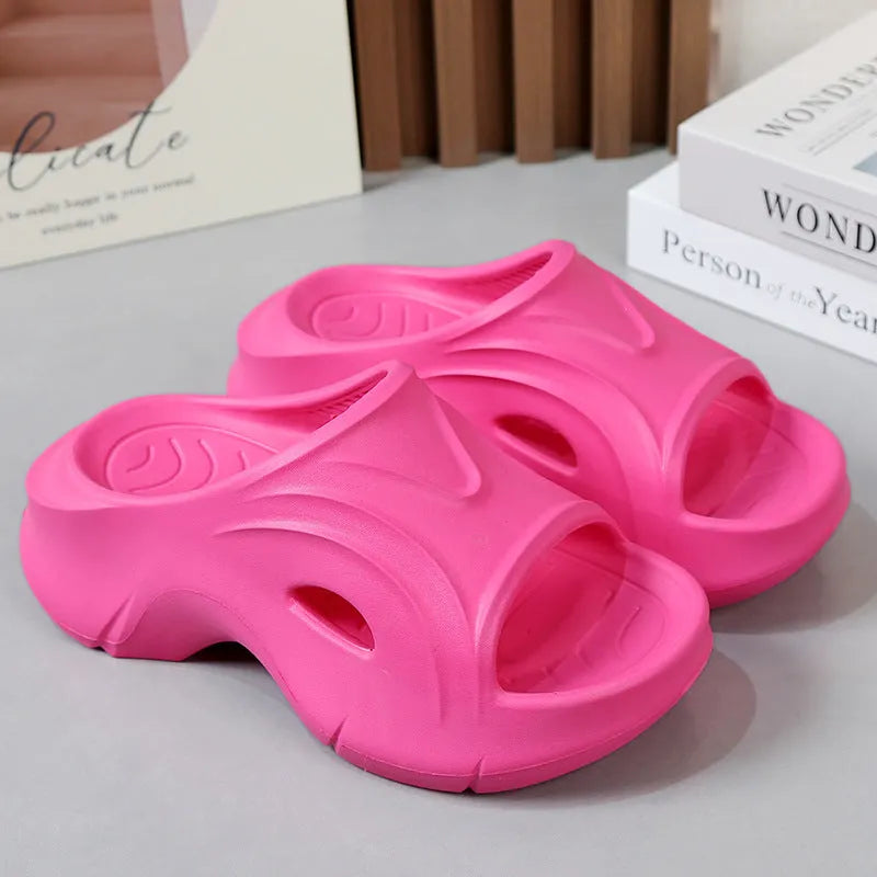 Women's thick-soled beach slippers in white, black, and rose red colours with EVA construction
