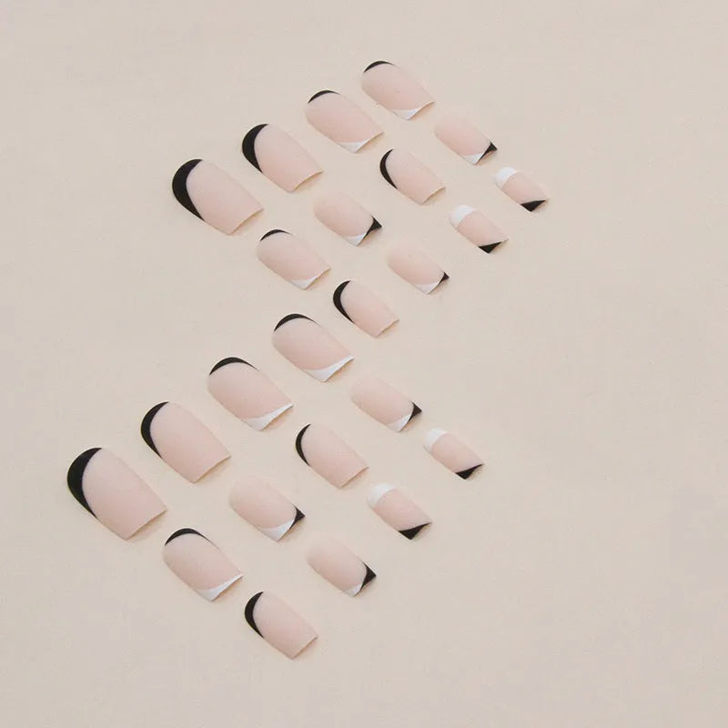 Black and white frosted artificial nail set for French manicures.