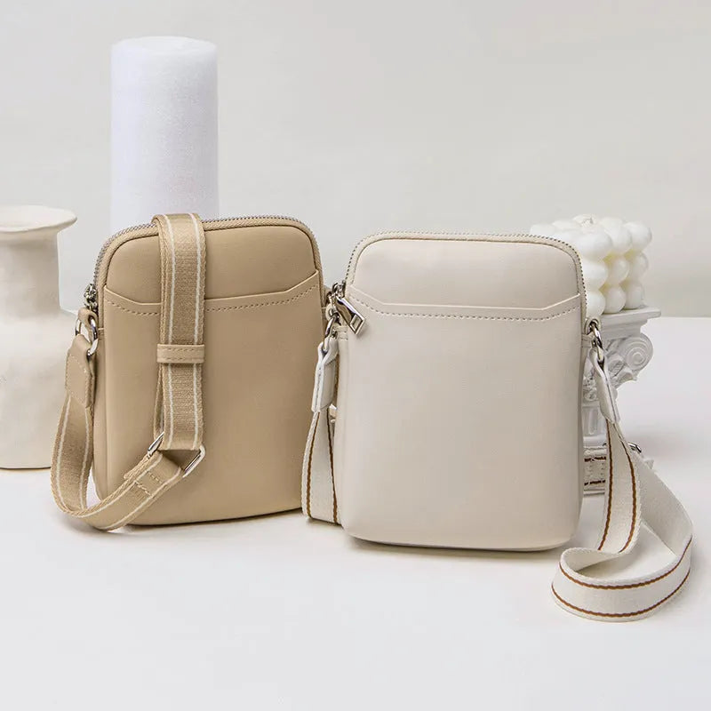 Solid colour PU leather crossbody phone bag for women shown in beige.