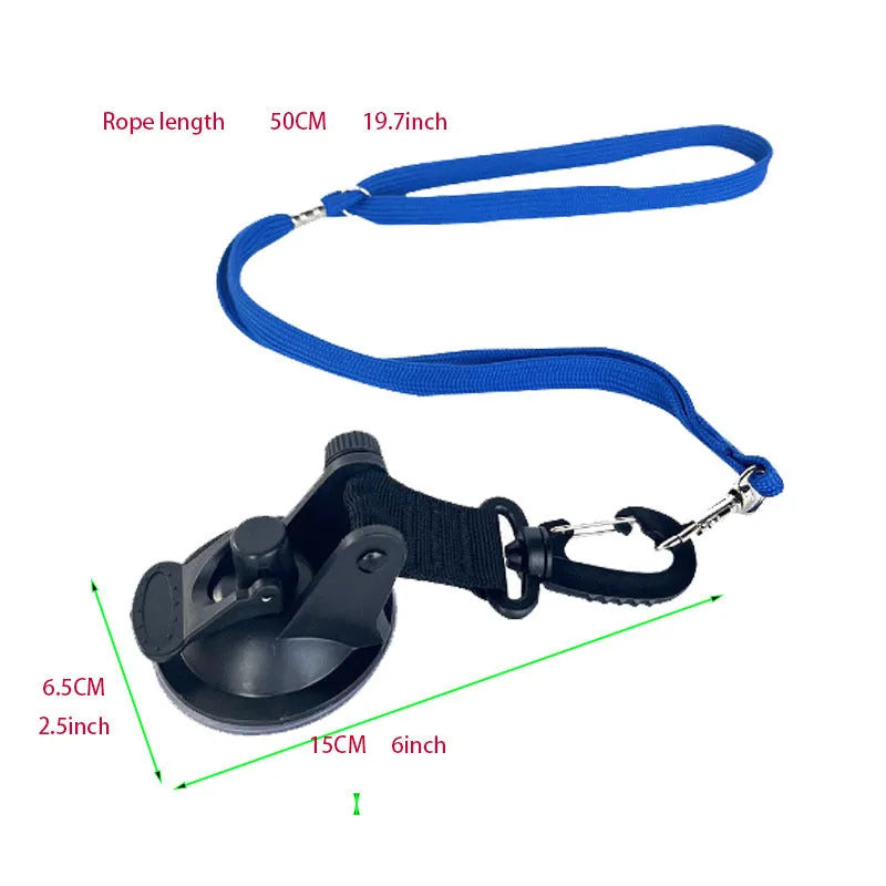 Pet bathing restraint tool with large suction cups, handcuffs, and a connecting rope on a bathroom tile background.