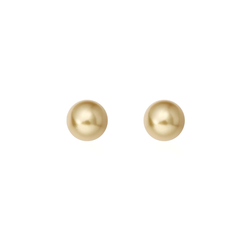 Women's large pearl stud earrings with an eight-pointed star geometric setting in sterling silver.