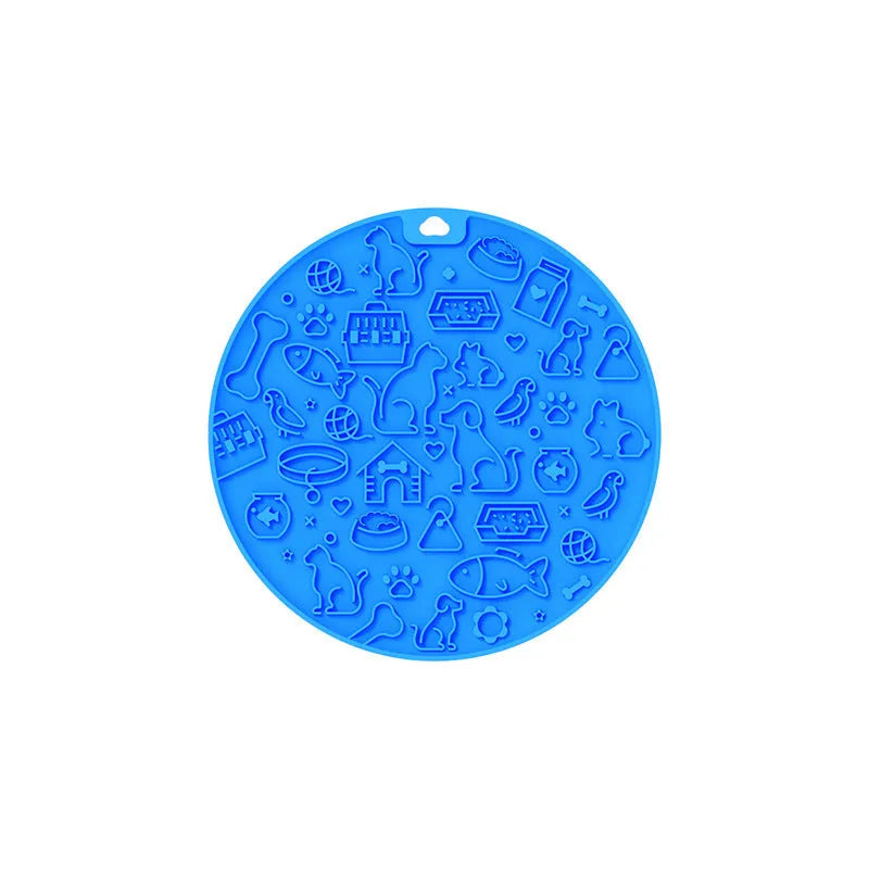 Round blue silicone pet lick mat with suction cup base on a kitchen counter