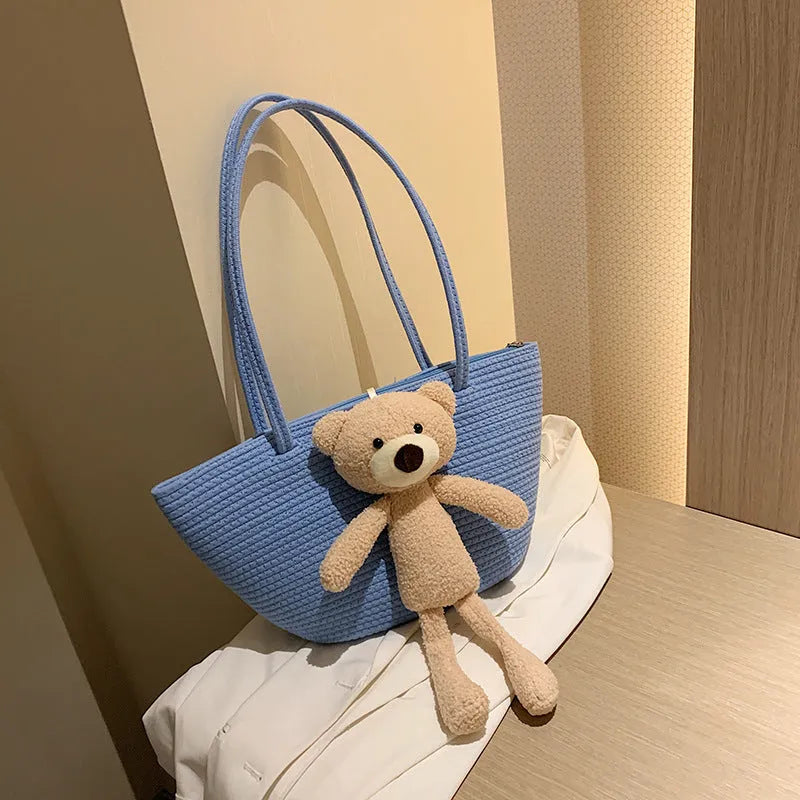 Cotton and linen woven shoulder bag with dumpling shape and double straps in multiple colours
