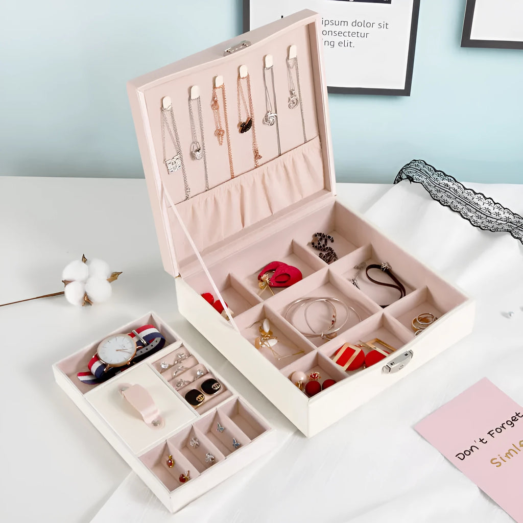 Red and white PU leather jewellery storage box with multiple compartments for necklaces and rings