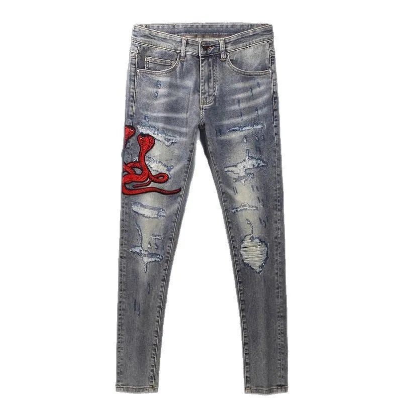 Men's slim fit old colour jeans with hole patch detail and embroidered branding on the leg