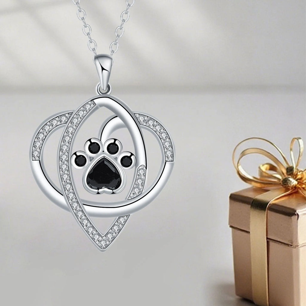 Copper pendant necklace with dog and cat paw print design on a cross chain