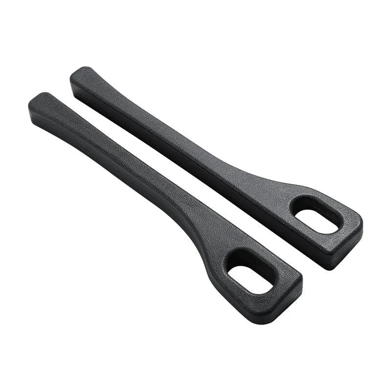 A flexible polyurethane car seat gap filler strip in black, placed between a car seat and centre console.