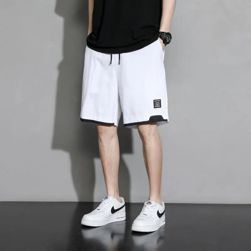 Boys' loose-fit cotton shorts in black, available in plus sizes for summer comfort.