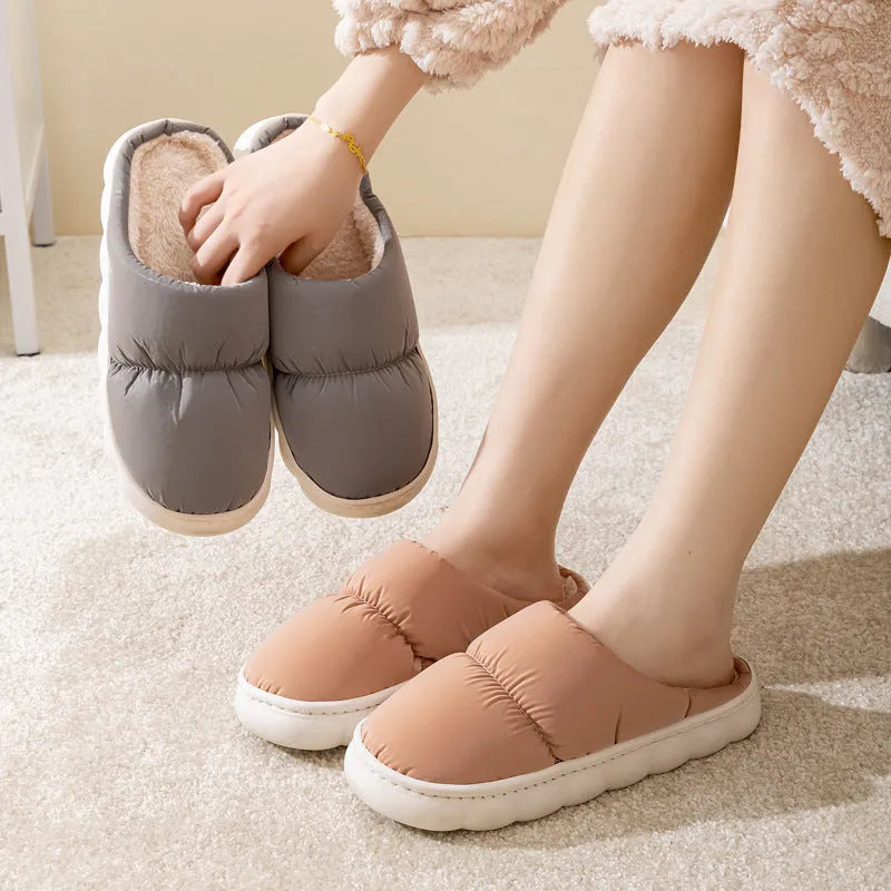 Blue winter slippers with artificial leather upper and thick rubber sole, showing plush lining.