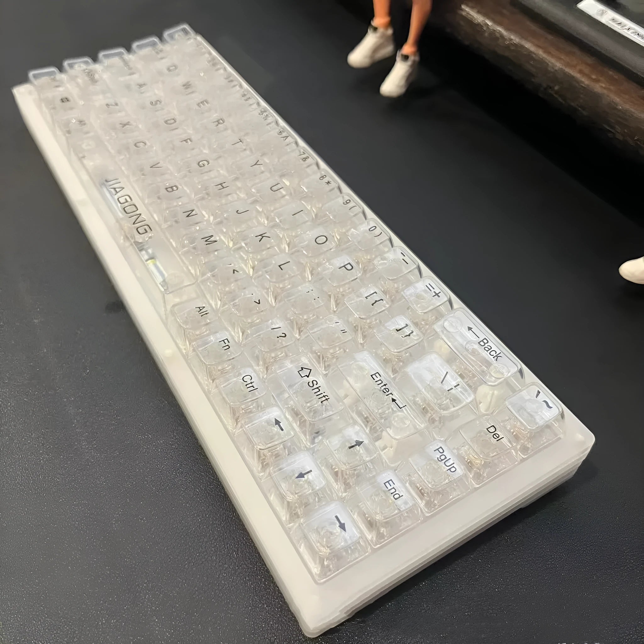 132 transparent plastic keyboard key caps arranged in full set with universal compatibility for mechanical and membrane keyboards