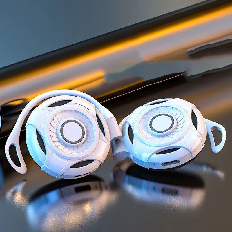 Black Bluetooth gaming earphones with hanging ear design showing USB charging port