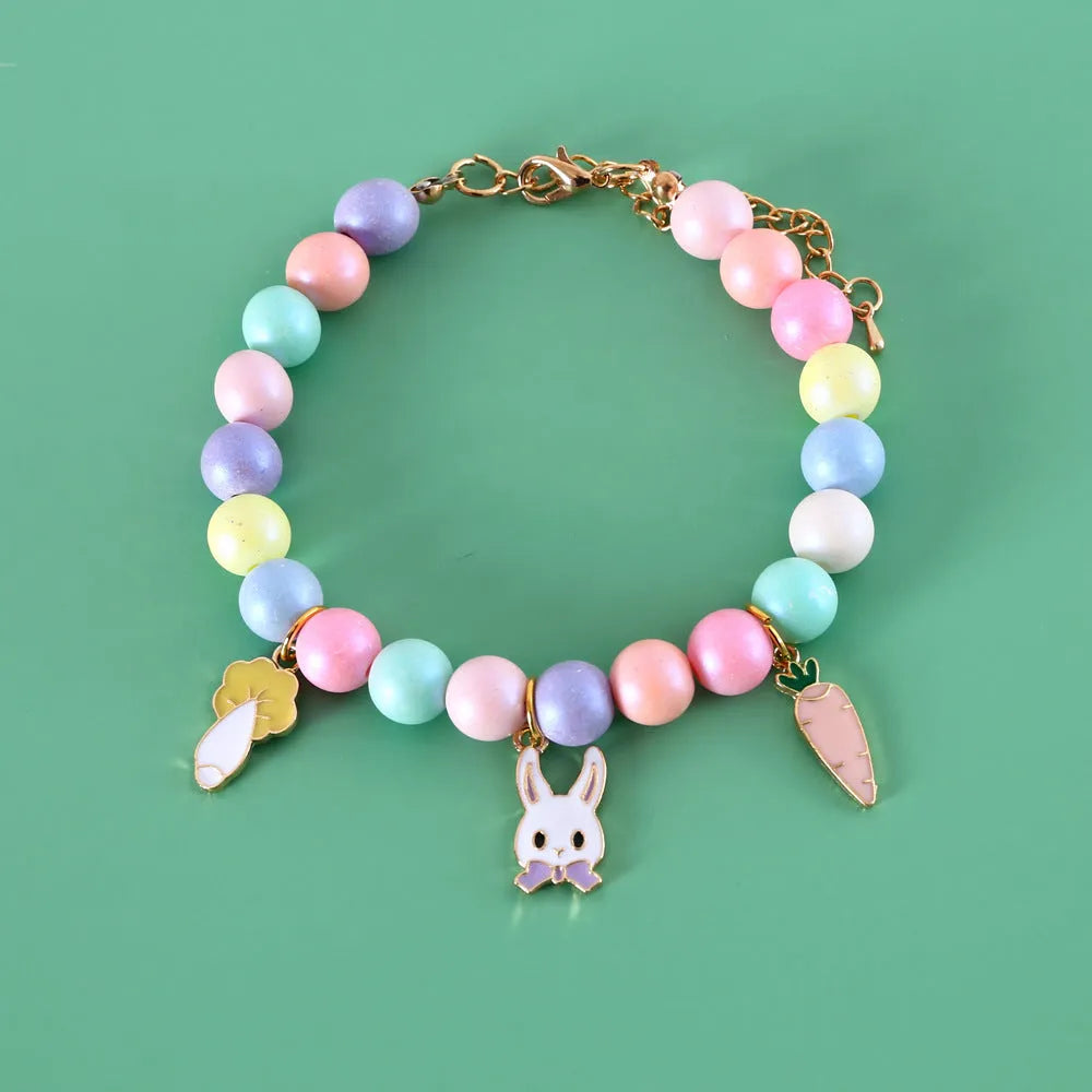 Pastel macaron charm pet collar with moon and rabbit designs on adjustable resin band for cats and dogs