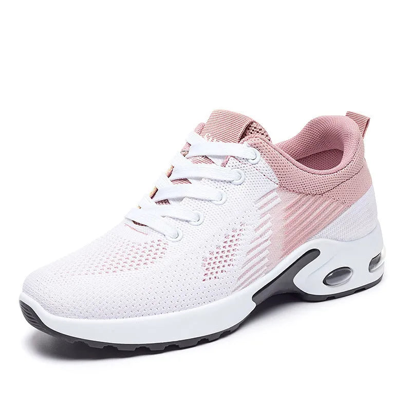 Women's Flyknit casual running shoes in striped pattern with lace-up front, shown in pink colour.