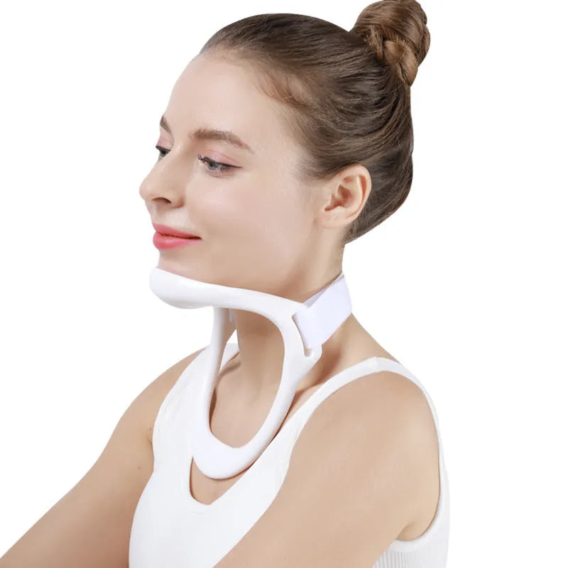 White PP plastic neck brace for cervical spine support on a neutral background.