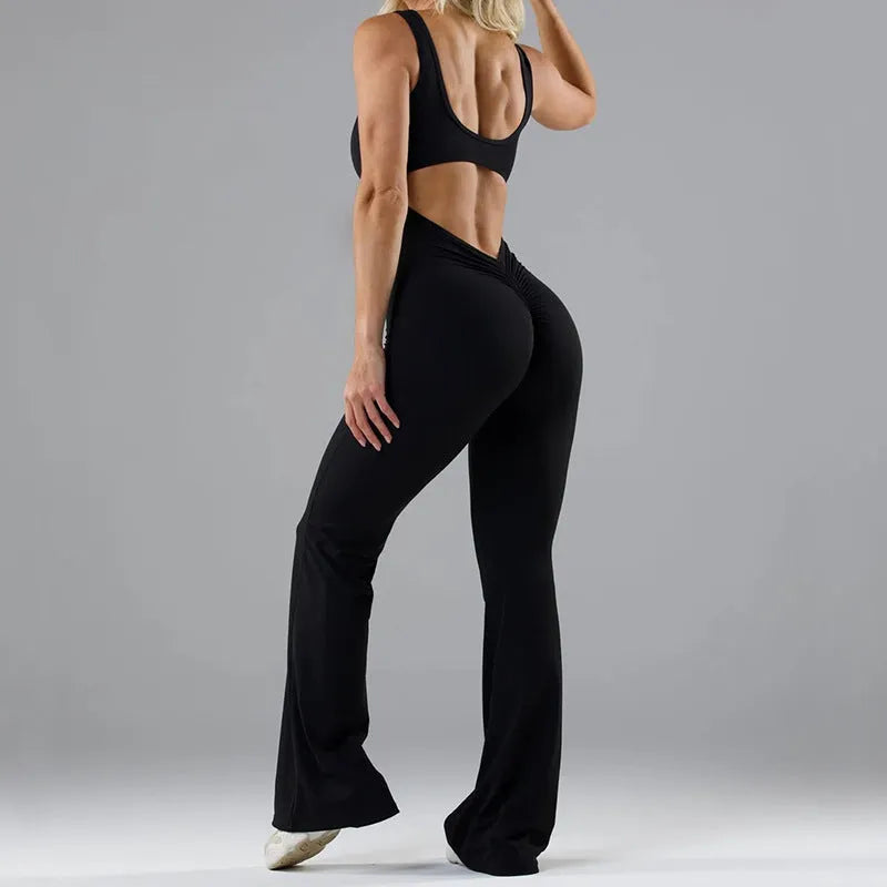 Women's black milk silk yoga bodysuit with seamless hollow design and mid-waist fit.