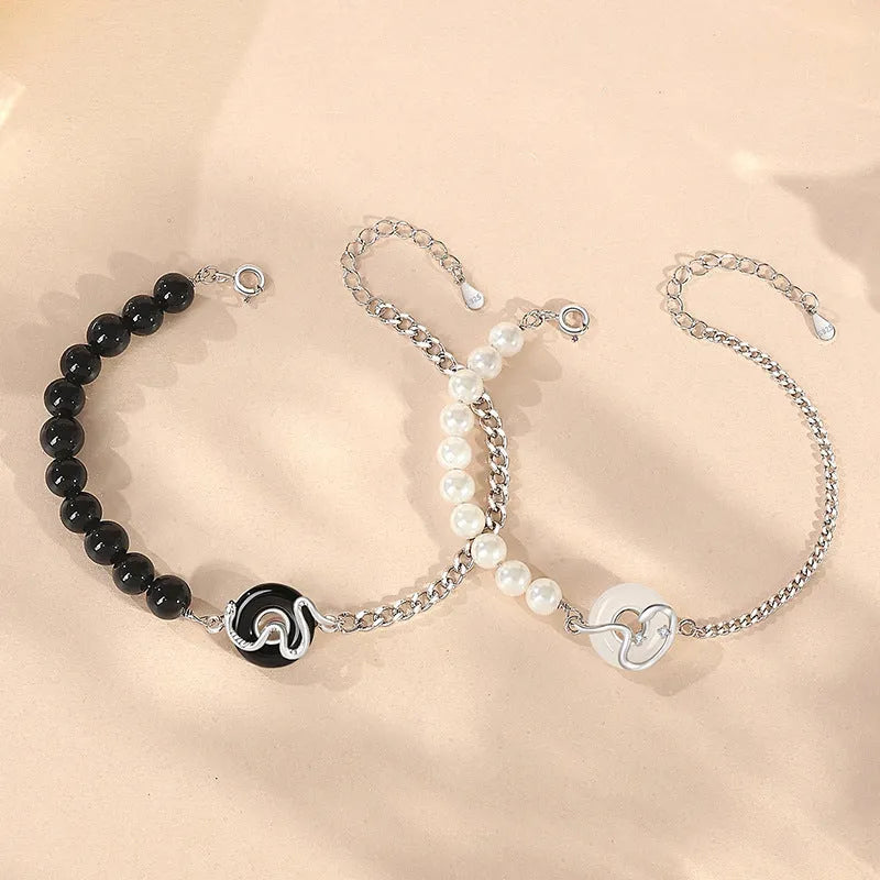 925 sterling silver couple bracelet with snake design, obsidian pearls, and a safe buckle.