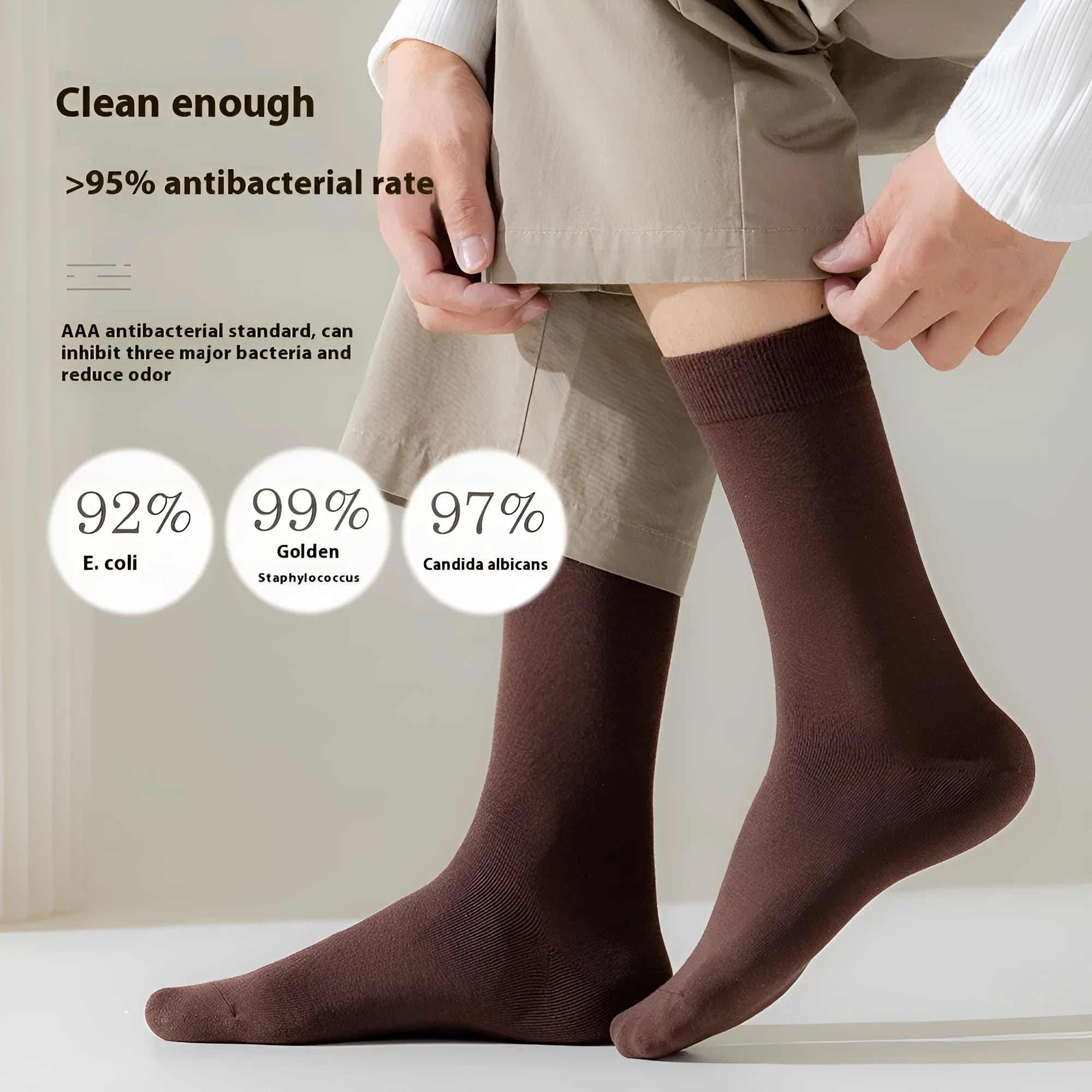 Solid colour mid-calf men's business socks in combed cotton on a white background.