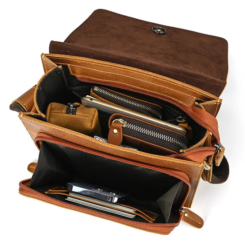 Brown men's leather crossbody shoulder bag with visible stitching and a long strap.