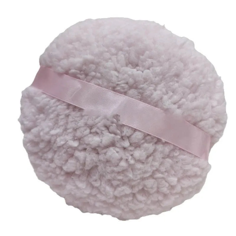 Oversized plush makeup powder puff in white, shown with dimensions 150mm by 75mm