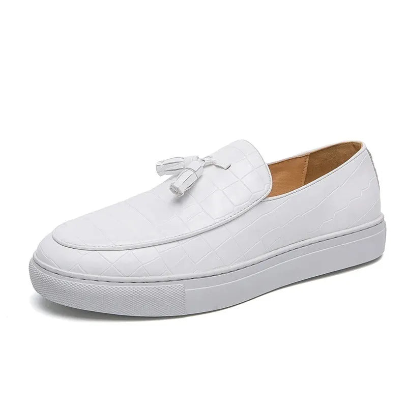 Men's black faux leather sneakers with a tassel detail on the upper, shown on a white background.