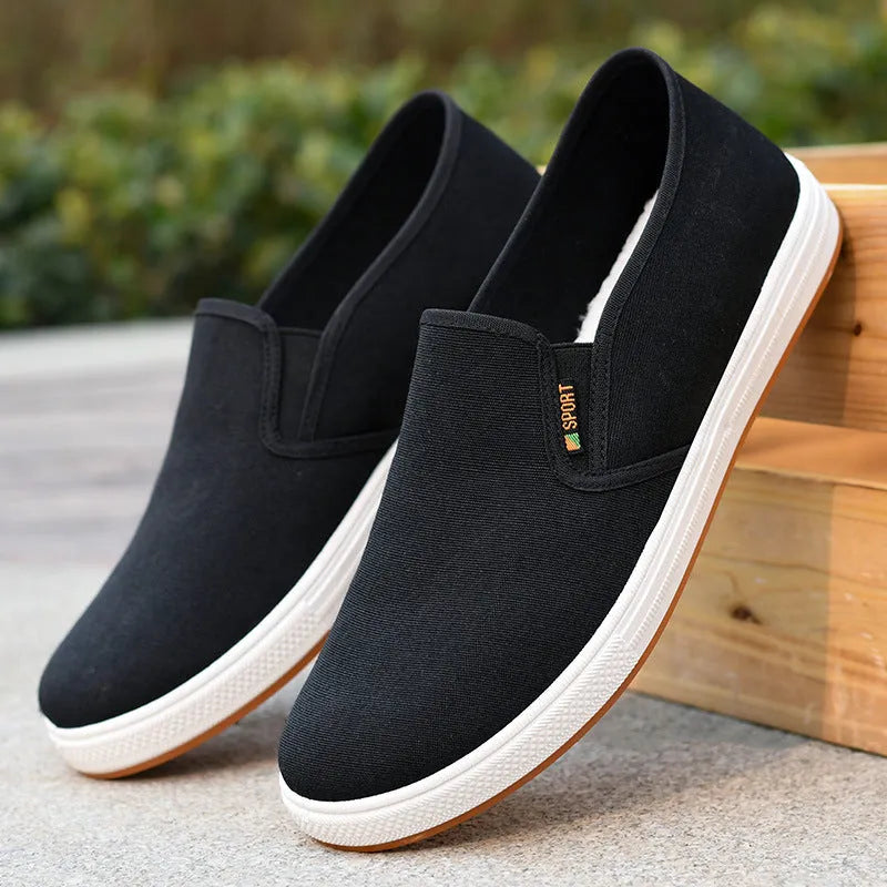 Men's low-top canvas slip-on shoes in BK Black colour with round toe design