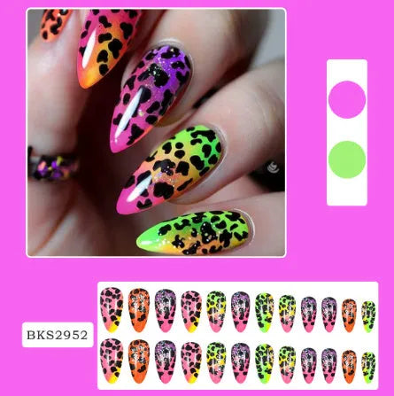 Four boxes of almond-shaped frosted nail stickers showing French leaves, leopard print, macaron and plating designs with tulip pattern