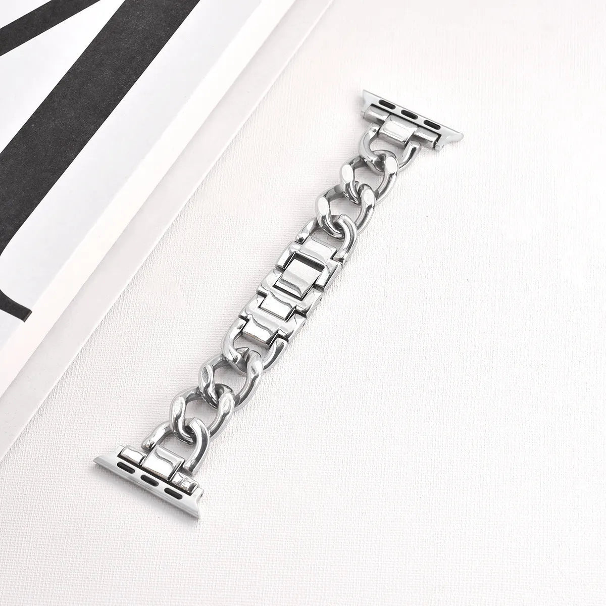 Metal denim chain replacement strap for Apple Watch in silver, black, gold, rose gold, and Starlight colours.