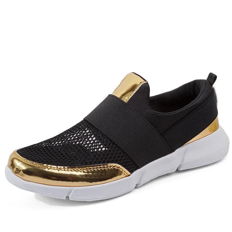 Women's blue, black, and grey lightweight mesh low-top sneakers on a hard floor.