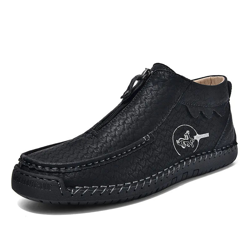 Men's black slip-on leather loafers with a round toe and rubber sole on a white background.