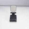 Multi-function lazy phone holder with Bluetooth speaker USB powered black white plastic