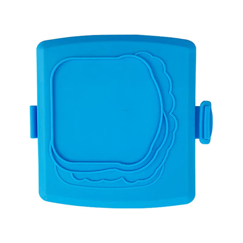 Red silicone baking tray with matching heat-resistant gloves on kitchen counter