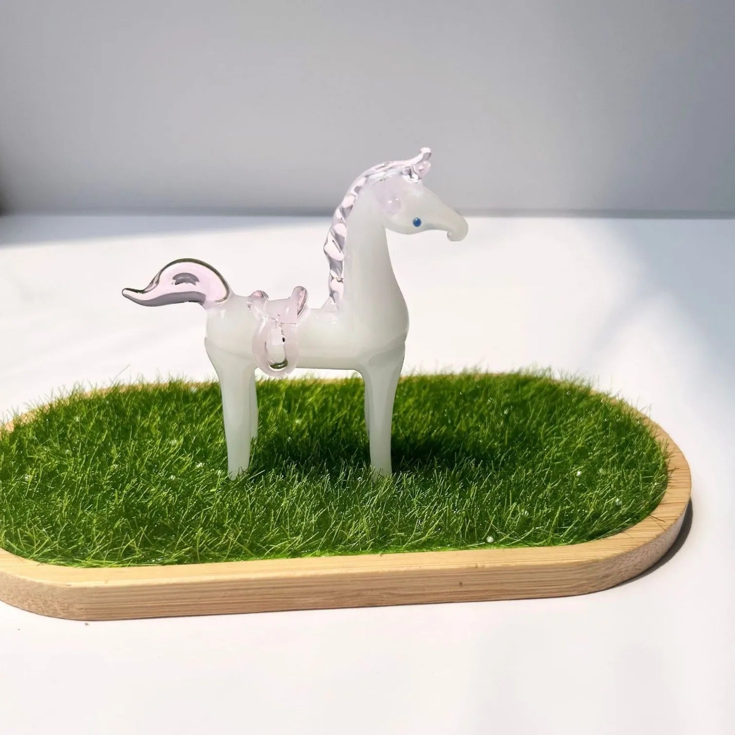 Brown coloured glaze horse decoration on wooden desk