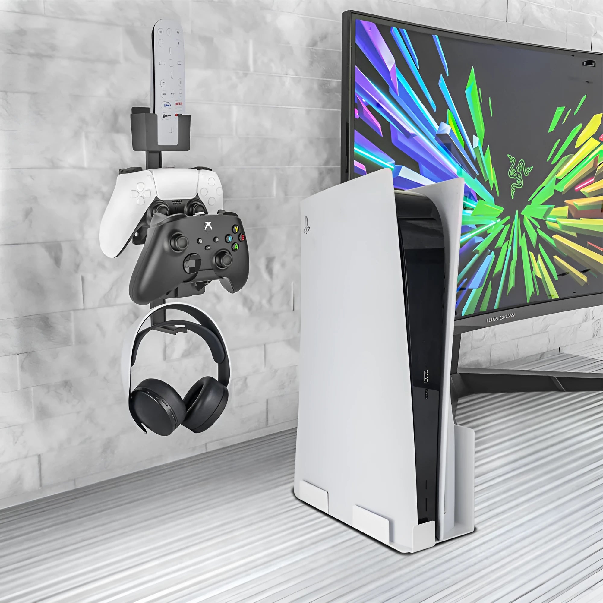 White ABS plastic wall hook holding a game controller and a black gaming headset.