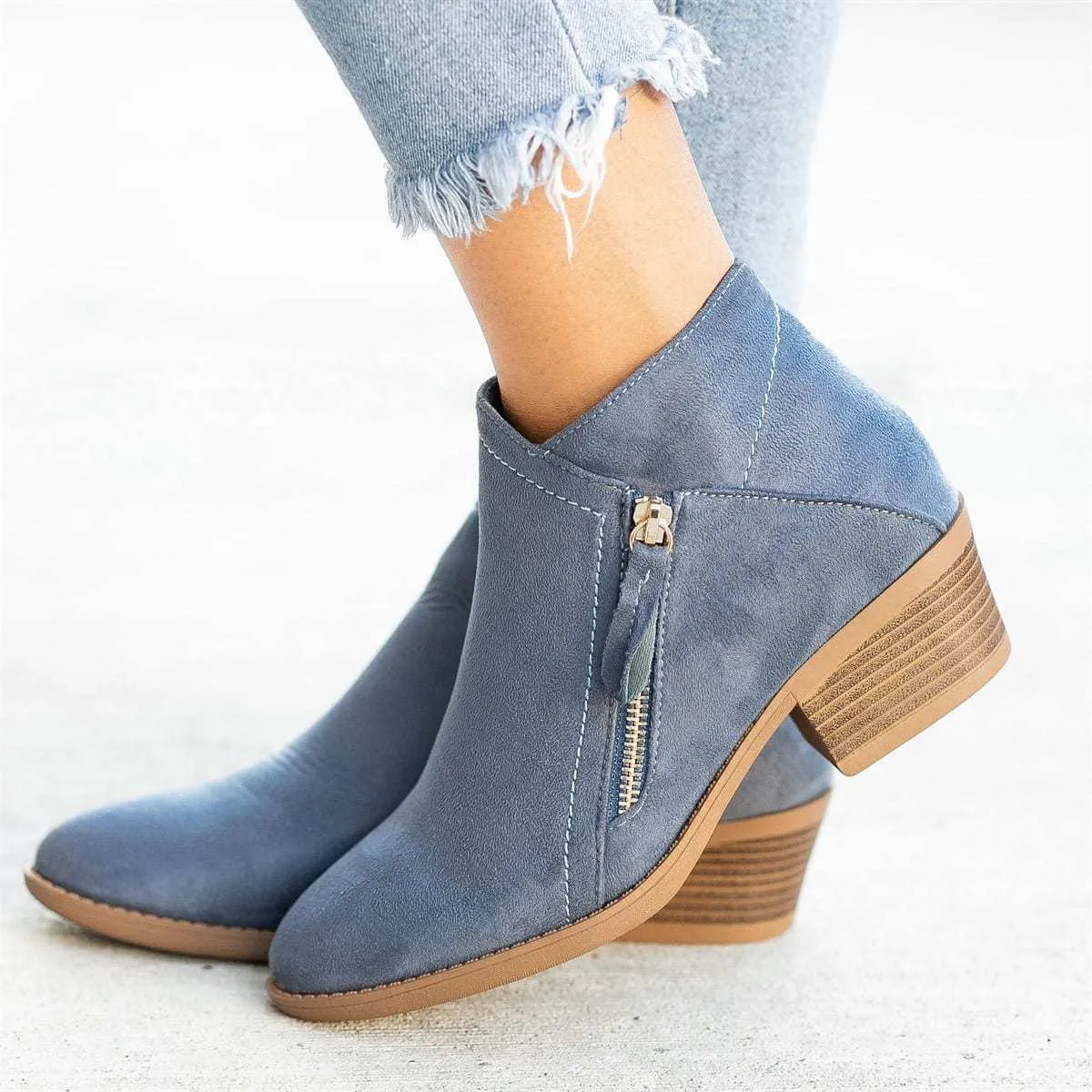 Women's suede ankle boot with side zip, chunky heel, in beige, black, blue, or orange.