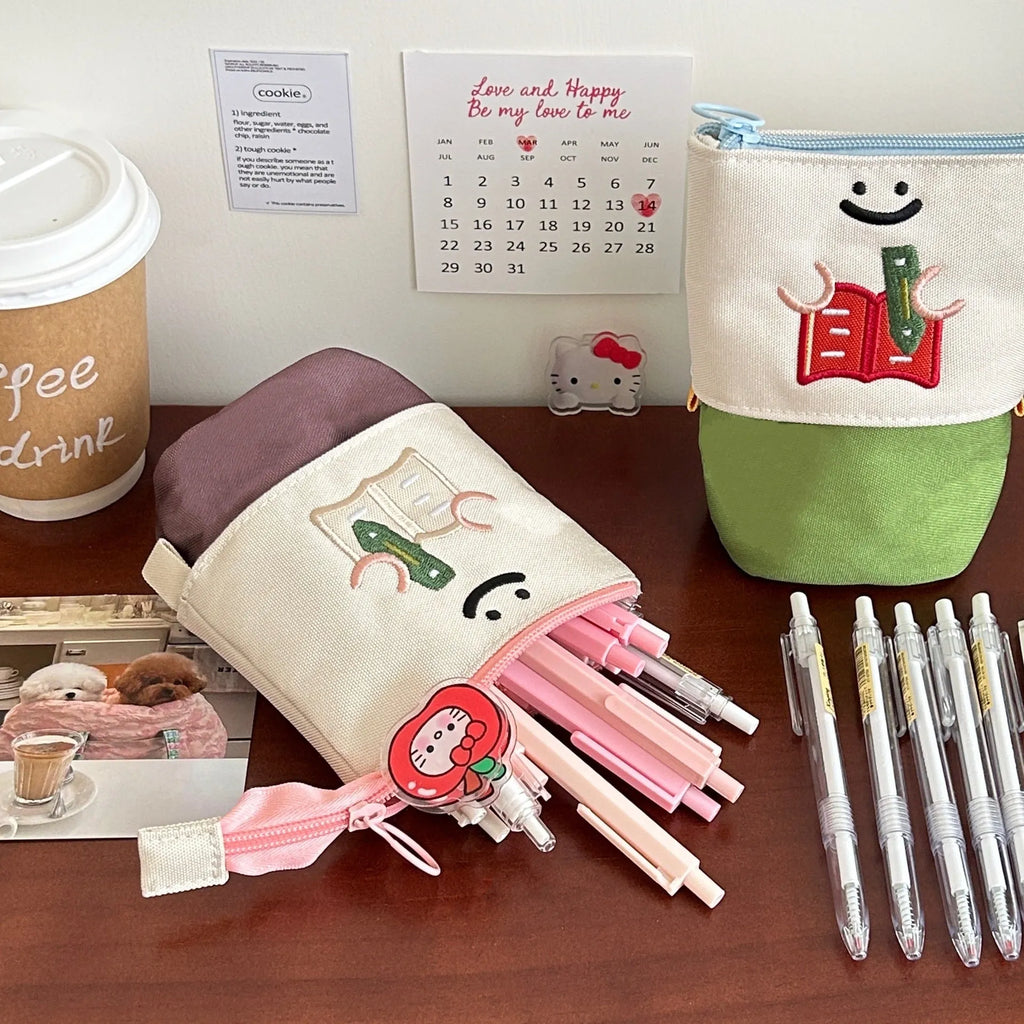 Cartoon Korean style collapsible pencil case in Oxford fabric showing brown and green colour options