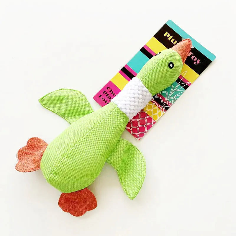 Blue, green, and grey duck-shaped durable dog plush toy with squeaker for chewing and play