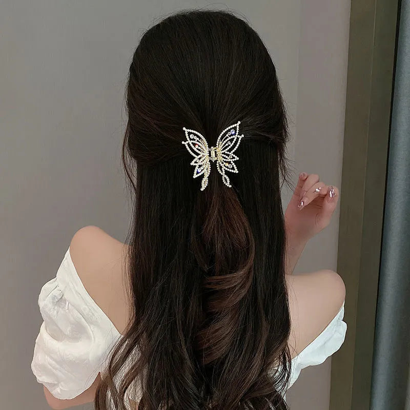 Butterfly-shaped hair clip with pearl or rhinestone decoration on alloy base
