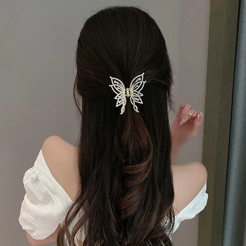 Butterfly-shaped hair clip with pearl or rhinestone decoration on alloy base