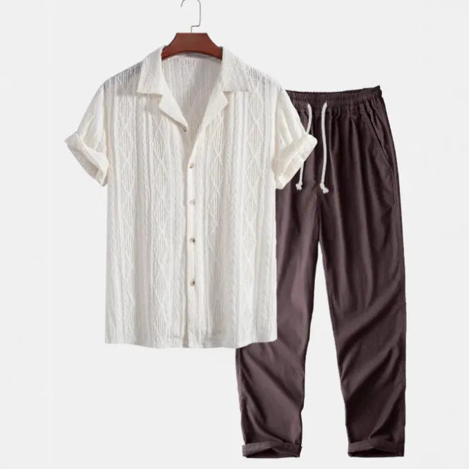 Men's camouflage print casual suit set with short-sleeve lapel shirt and trousers on a hanger.