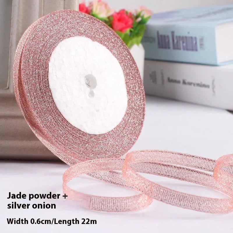 Roll of narrow 0.6cm wide polyester gift wrapping ribbon in assorted colours, showing 22 metre length.