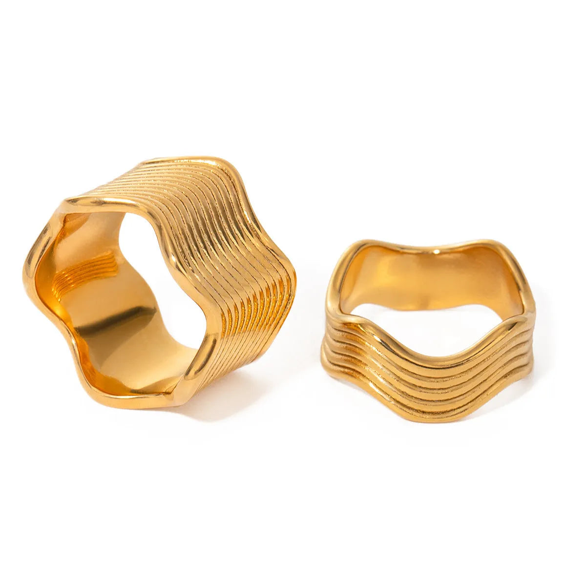 Stainless steel geometric wave ring for women with a wide surface area and electroplated finish.