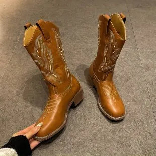 Brown women's mid-calf boots with embroidery detail, round toe, and low square heel.