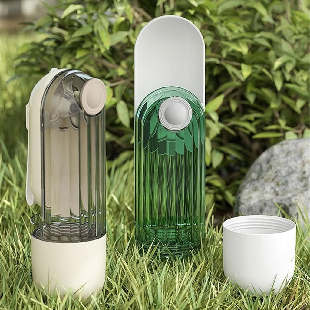 Beige foldable dog water bottle with a press-button dispenser and a small food container at the base.