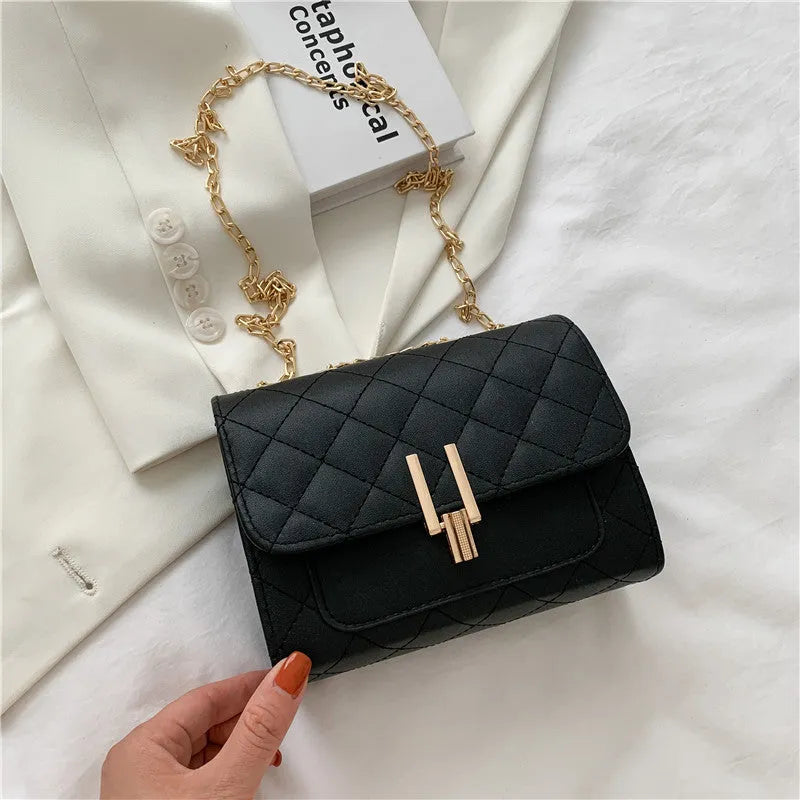 Women's crossbody bag with diamond lattice chain detailing and adjustable shoulder strap