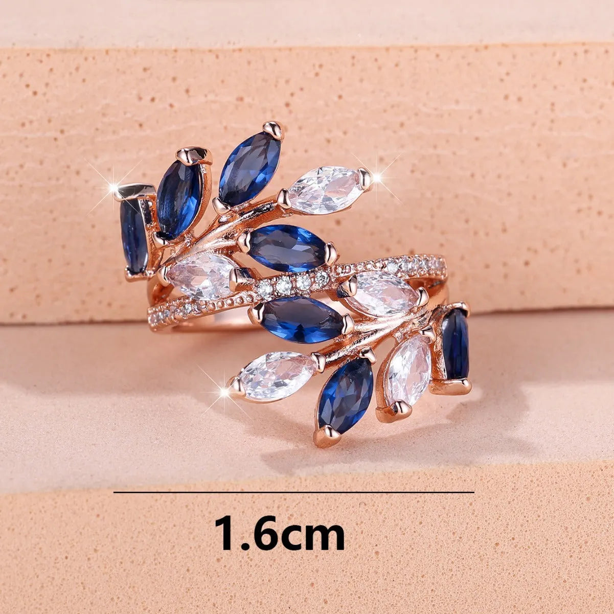 Adjustable horse eye zircon leaf ring in copper on a hand, showing leaf detail and colour options.