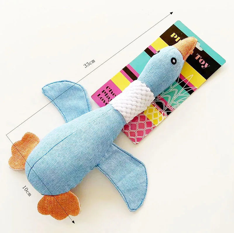 Blue, green, and grey duck-shaped durable dog plush toy with squeaker for chewing and play