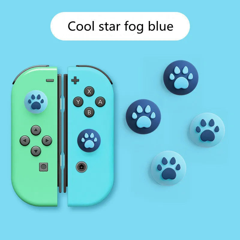 Four silicone rocker caps for Nintendo Switch Joy-Con controllers in assorted colours on a grey background.