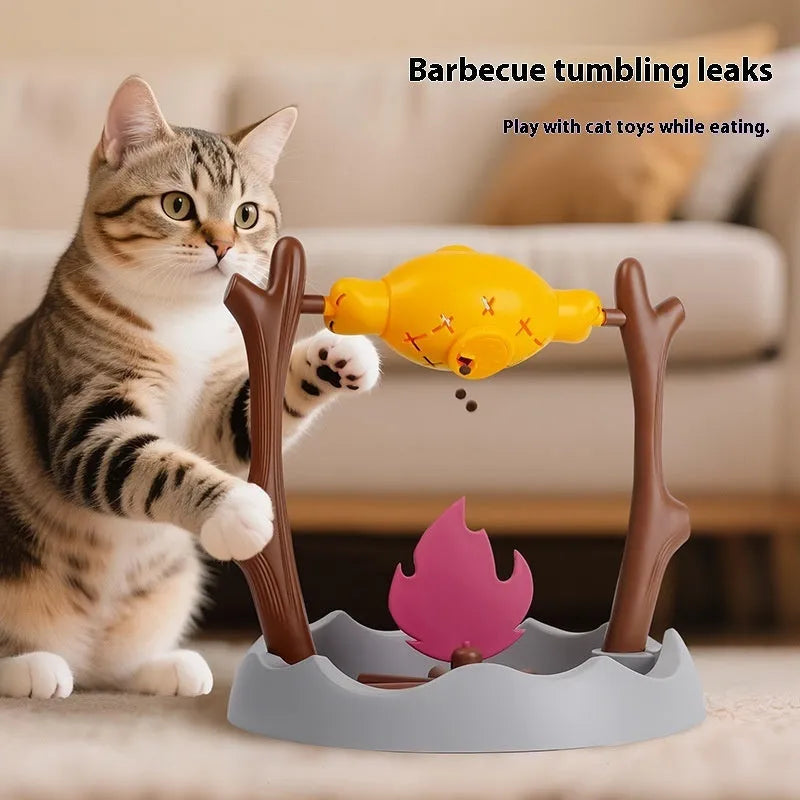 Barbecue-shaped plastic cat feeder toy for dispensing dry kibble during play.