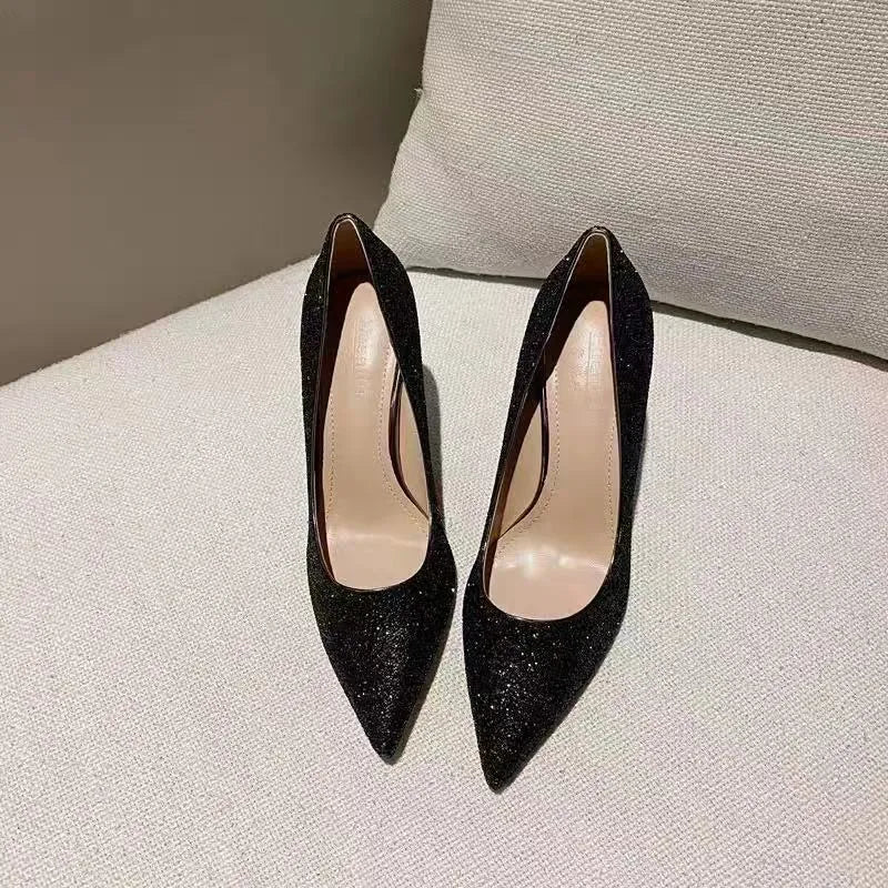 Women's silver and black bridal wedding shoes with crystal details and multiple heel heights