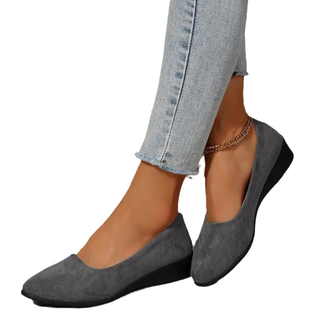 Women's suede wedge pump in light brown with a pointed toe and low rubber sole.